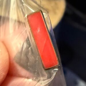 Red color bar set in gold keep collective charm